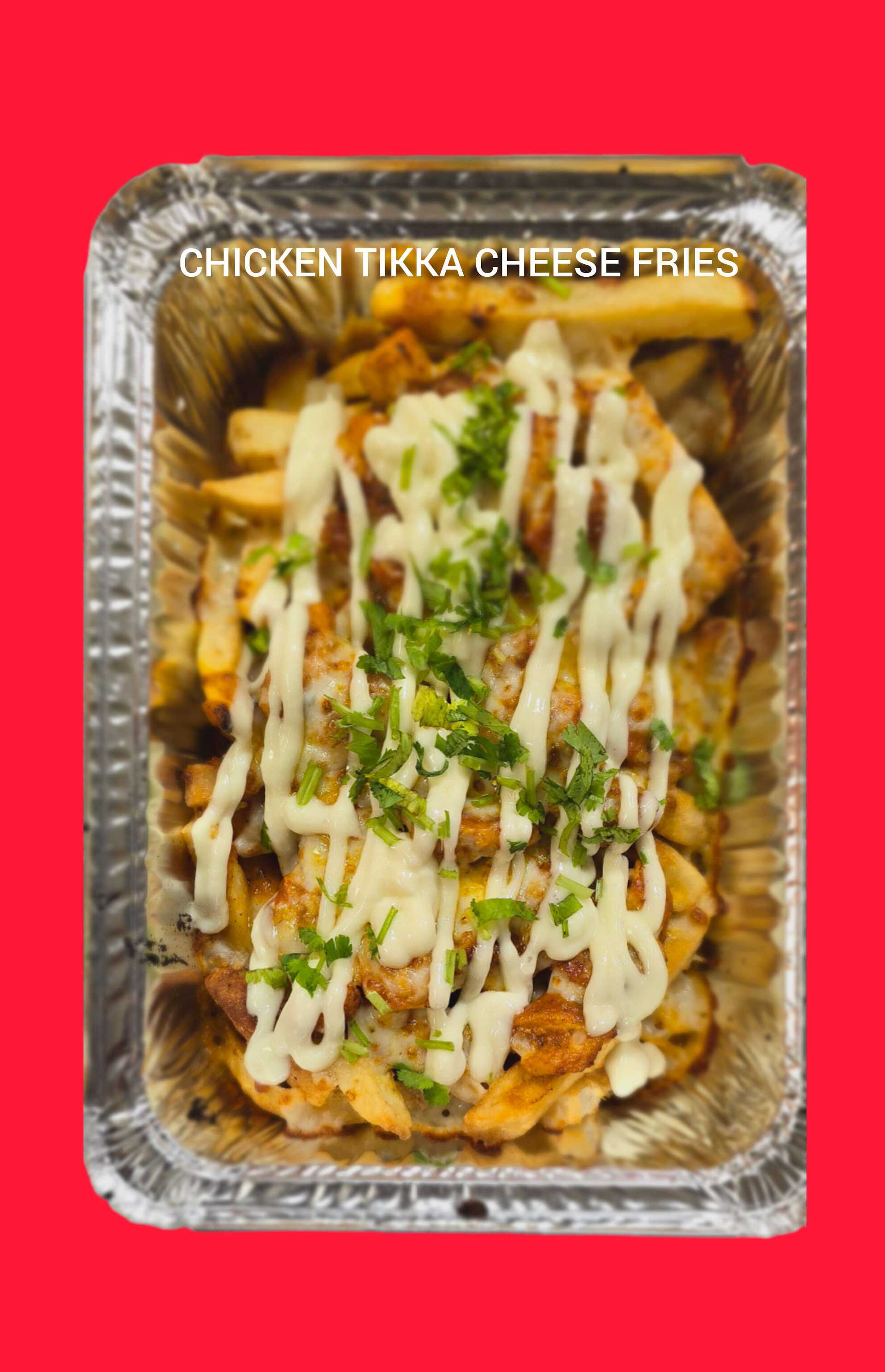 Chicken tikka cheese fries in a foil container, topped with melted cheese and fresh herbs.